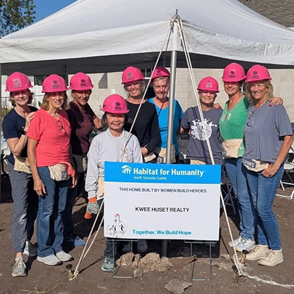 Courtside Tennis Club, Venice, Florida - group of people wearing hard hats in construction area