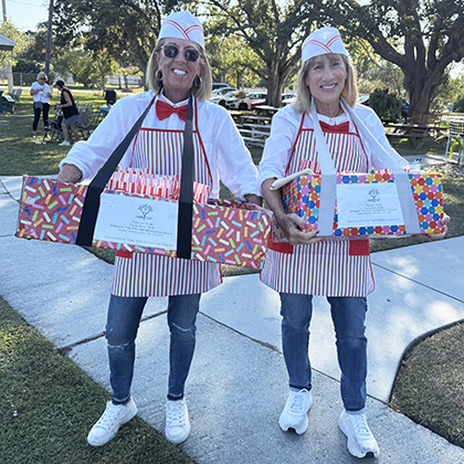 Courtside Tennis Club, Venice, Florida - popcorn for sale, two women in costume